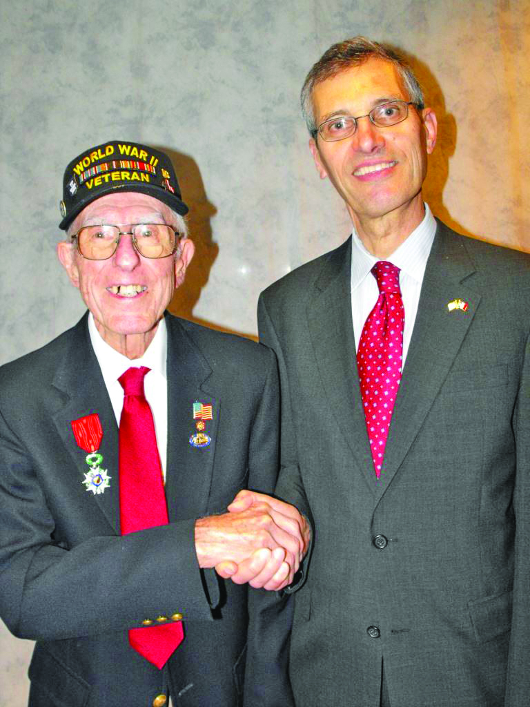 Honorary Consul of France in Pittsburgh Jean-Dominique Le Garrec congratulates WWII vet Glenn E. Kempf on his Chevalier of the Legion of Honor award.