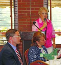 Keynote speaker Jeanette Matthews. Seated are program manager John Miller and Care Coordination Division Chief Kimberly Hall.